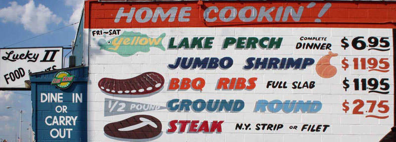 Traditional Food Menu on the side of a Building